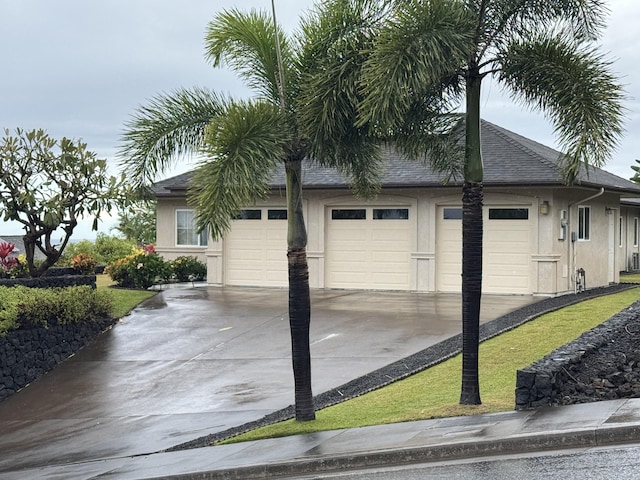 view of side of property featuring a garage