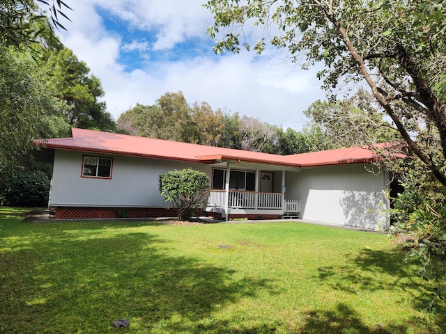 view of front of property with a front yard and covered porch