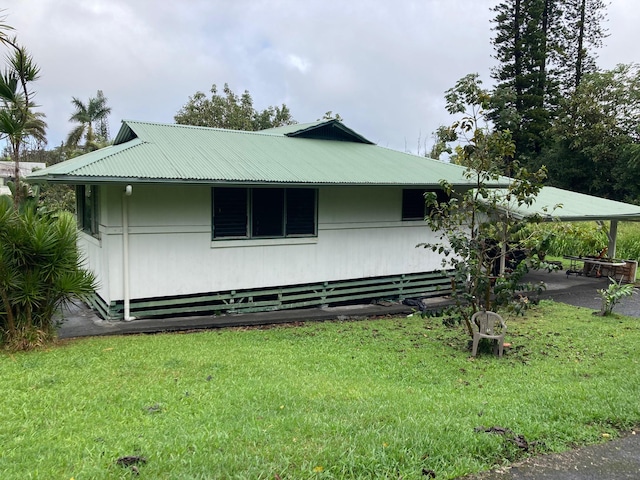 view of property exterior featuring a lawn