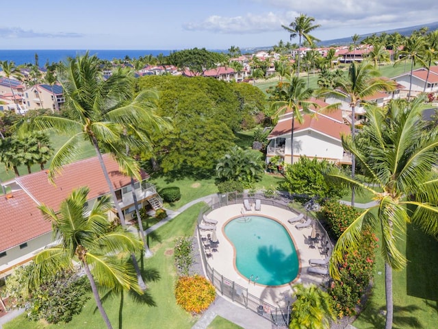 birds eye view of property with a water view