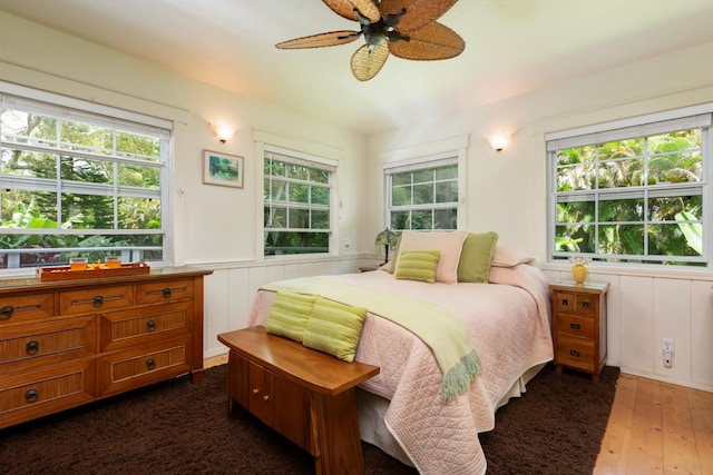 bedroom featuring ceiling fan and dark hardwood / wood-style floors