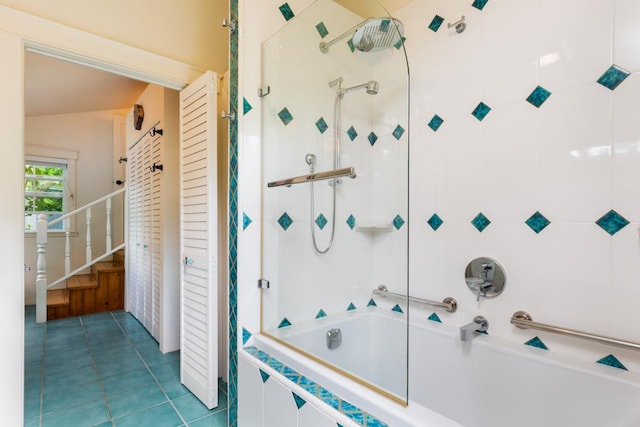 bathroom featuring tiled shower / bath and tile patterned floors