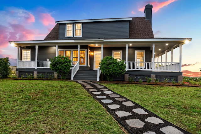 view of front facade featuring a yard and covered porch