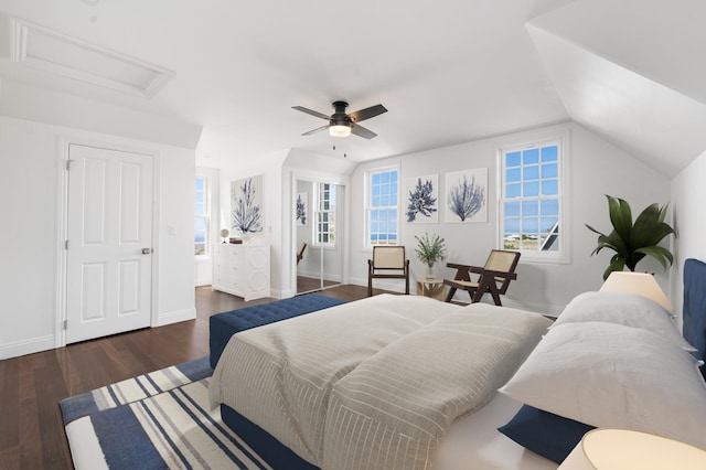 bedroom with multiple windows, lofted ceiling, dark hardwood / wood-style floors, and ceiling fan