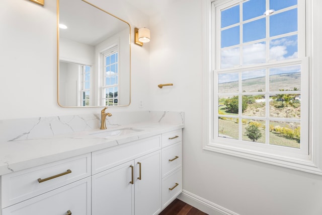 bathroom featuring a healthy amount of sunlight and vanity