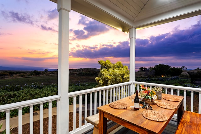 view of balcony at dusk