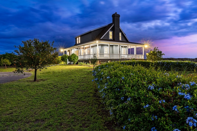 exterior space featuring a lawn and a sunroom