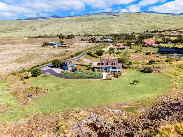 drone / aerial view featuring a mountain view and a rural view