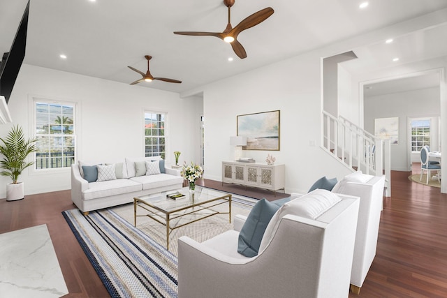 living room featuring ceiling fan, dark hardwood / wood-style floors, and a healthy amount of sunlight