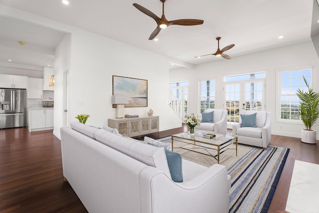 living room featuring dark hardwood / wood-style floors and ceiling fan