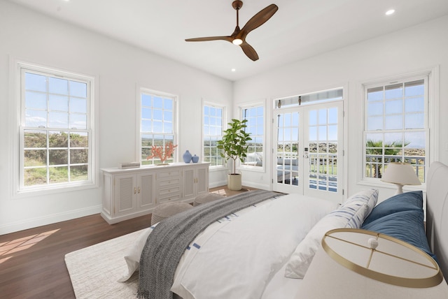 bedroom with dark hardwood / wood-style floors, access to exterior, ceiling fan, and french doors