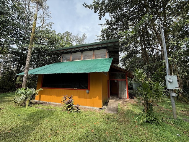 view of outbuilding with a yard