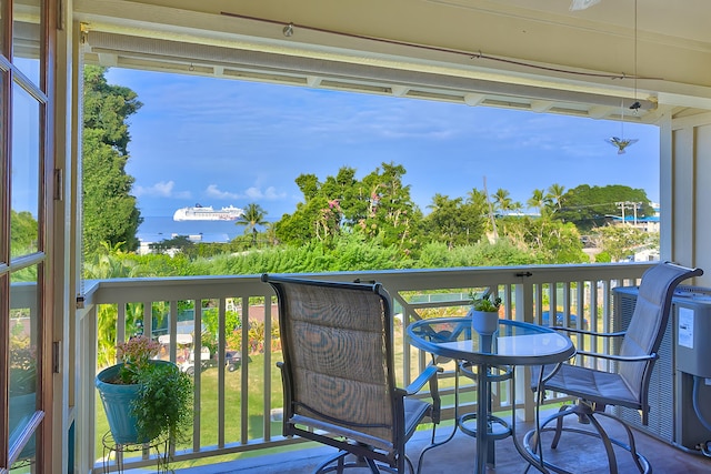 balcony featuring a water view