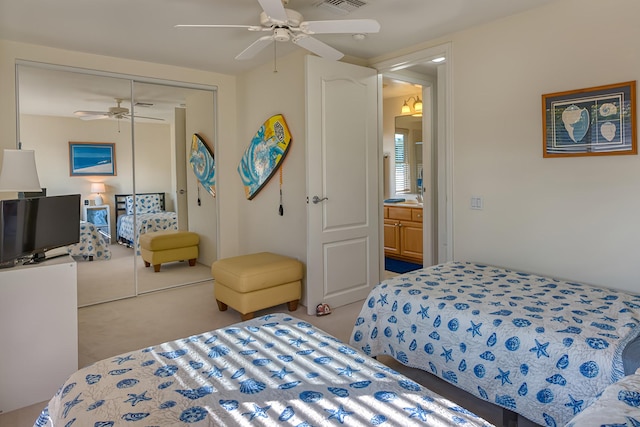 bedroom with light carpet, a closet, and ceiling fan