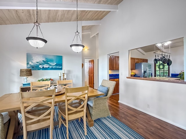 dining space featuring wood-type flooring, vaulted ceiling with beams, and wooden ceiling