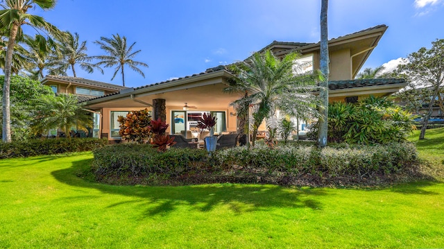 exterior space featuring a lawn and stucco siding