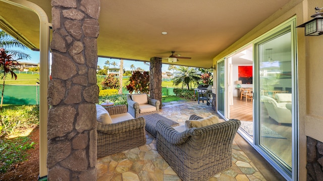 view of patio featuring ceiling fan and outdoor lounge area