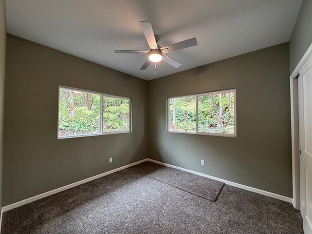 unfurnished bedroom with ceiling fan, a closet, and carpet