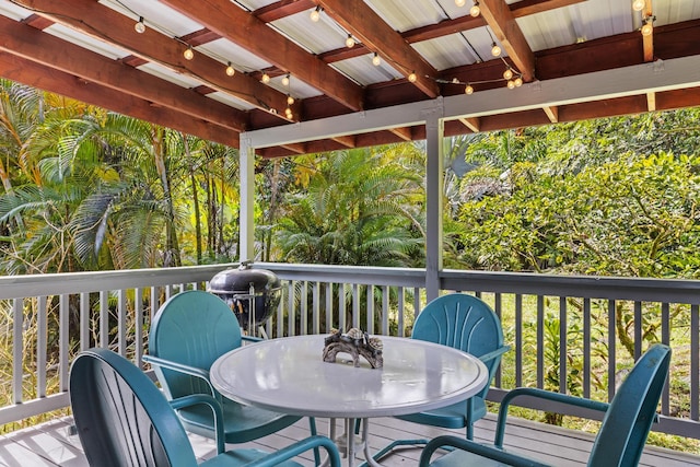 wooden deck with outdoor dining space