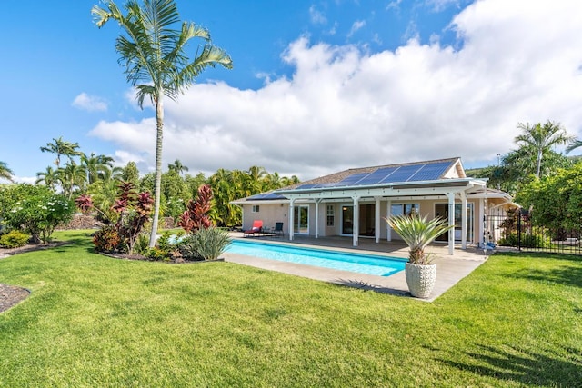 view of pool with a yard and a patio