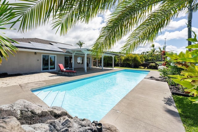 view of swimming pool featuring a patio