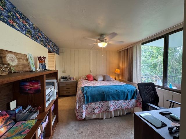 carpeted bedroom featuring ceiling fan