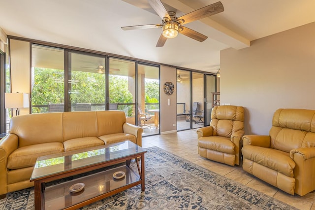 tiled living room featuring ceiling fan and a wall of windows