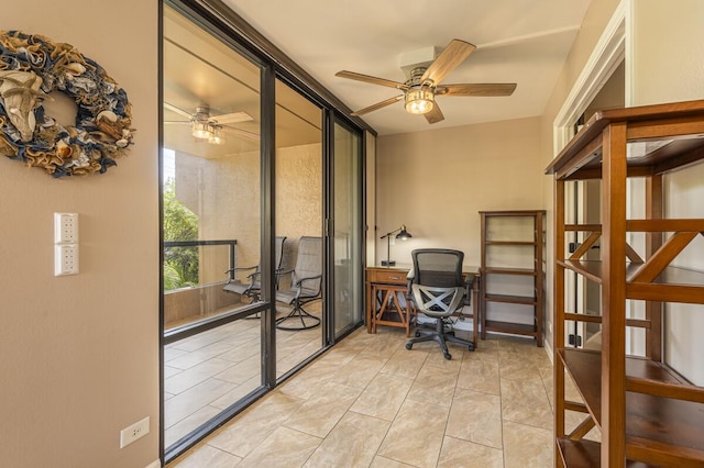 office area with light tile patterned floors, ceiling fan, and a wall of windows