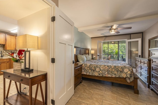 bedroom with beam ceiling and sink