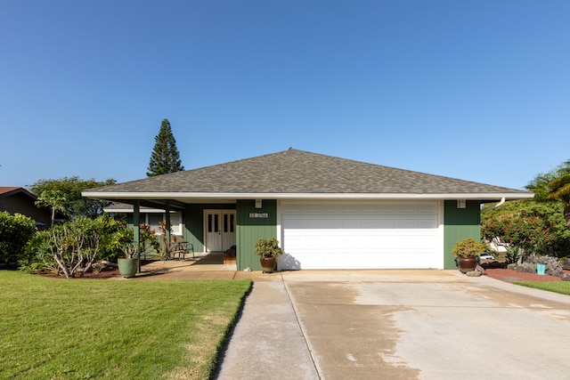 ranch-style home with a garage and a front yard