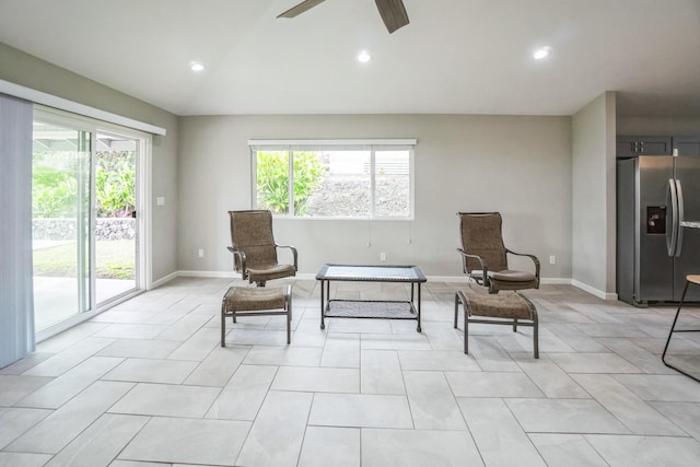 living area with lofted ceiling, baseboards, a ceiling fan, and recessed lighting