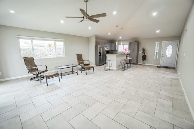 interior space featuring light tile patterned floors, recessed lighting, a ceiling fan, high vaulted ceiling, and baseboards