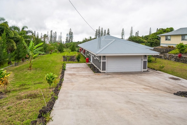 view of front of property featuring concrete driveway and a front lawn