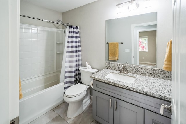 bathroom featuring toilet, tile patterned flooring, shower / bath combination with curtain, and vanity