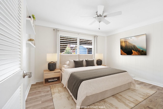 bedroom featuring crown molding, ceiling fan, and light hardwood / wood-style floors