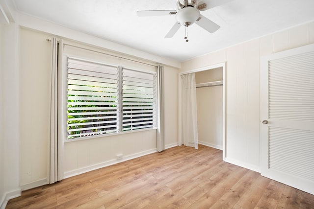 unfurnished bedroom with a closet, ceiling fan, and light wood-type flooring