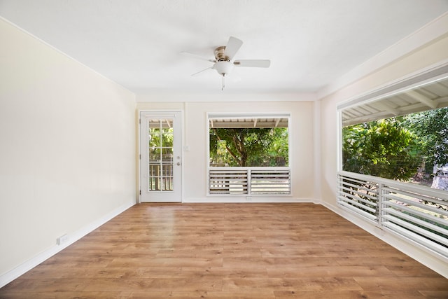 interior space with ceiling fan