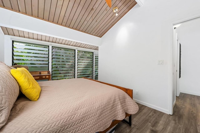 bedroom featuring vaulted ceiling, hardwood / wood-style floors, and wooden ceiling