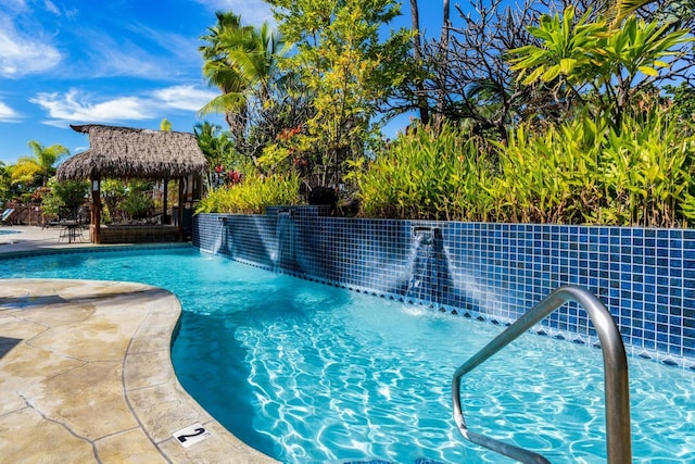 view of swimming pool with a gazebo and pool water feature