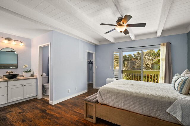 bedroom with beamed ceiling, access to outside, a sink, dark wood finished floors, and baseboards