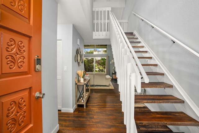 stairs featuring baseboards and wood finished floors