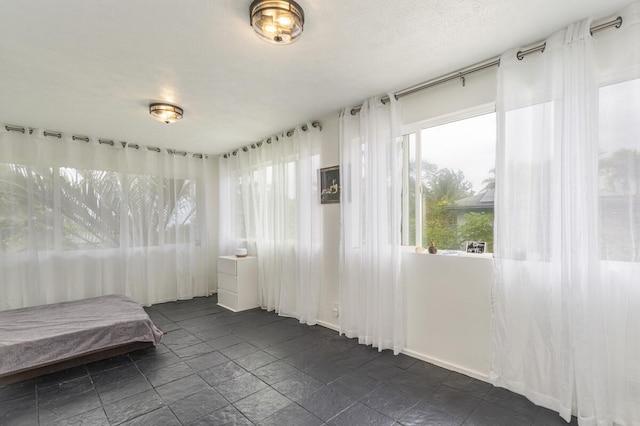 unfurnished bedroom featuring a textured ceiling