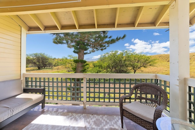 wooden balcony featuring a deck