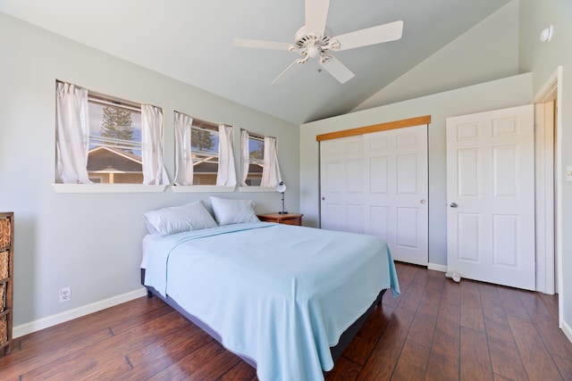 bedroom featuring vaulted ceiling, ceiling fan, dark hardwood / wood-style flooring, and a closet