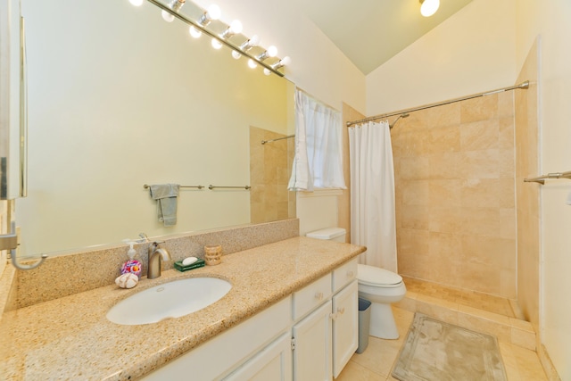 bathroom featuring tile patterned floors, toilet, a shower with curtain, vaulted ceiling, and vanity