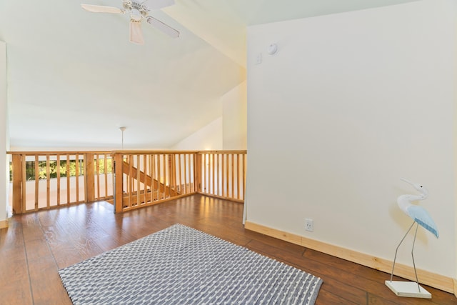 unfurnished room with hardwood / wood-style flooring, lofted ceiling, and ceiling fan