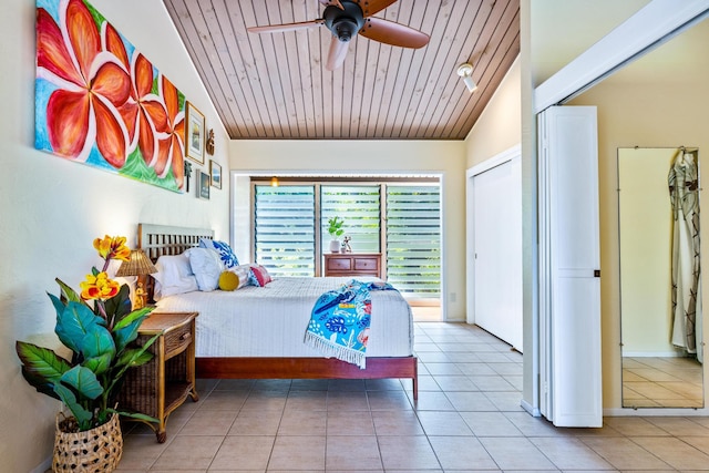 bedroom featuring ceiling fan, lofted ceiling, wooden ceiling, and light tile patterned floors