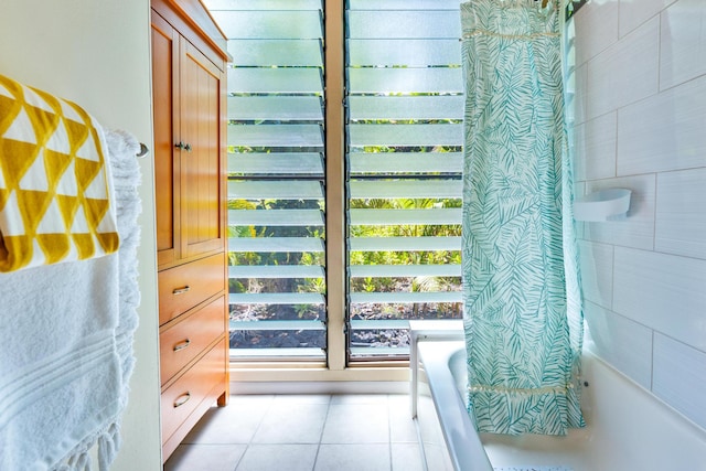 bathroom with tile patterned floors