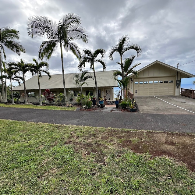 ranch-style home featuring a garage