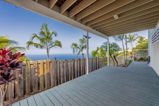 wooden terrace featuring a water view